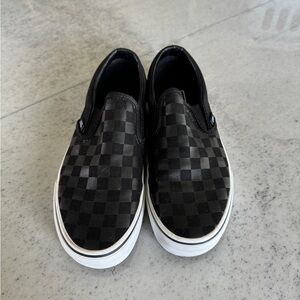 Black checkered slip on vans
